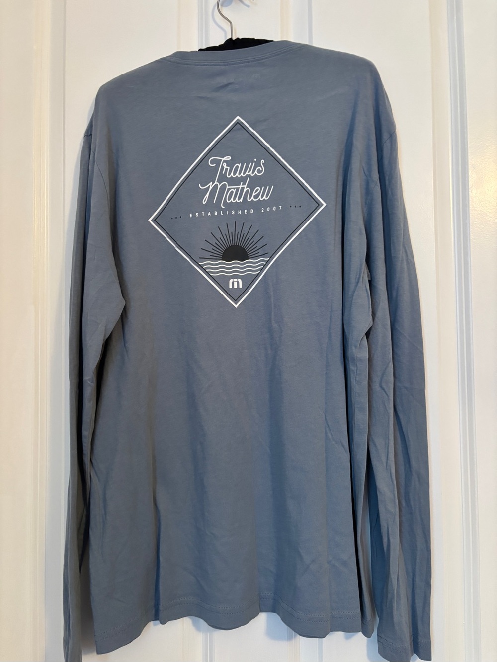 Travis Mathew Long Sleeve Crew Tee in Slate Blue with White Back Graphic. Size L